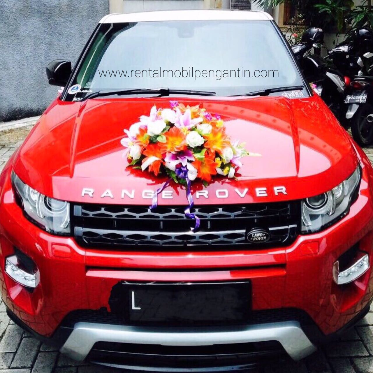 sewa mobil pengantin range rover evoque merah surabaya